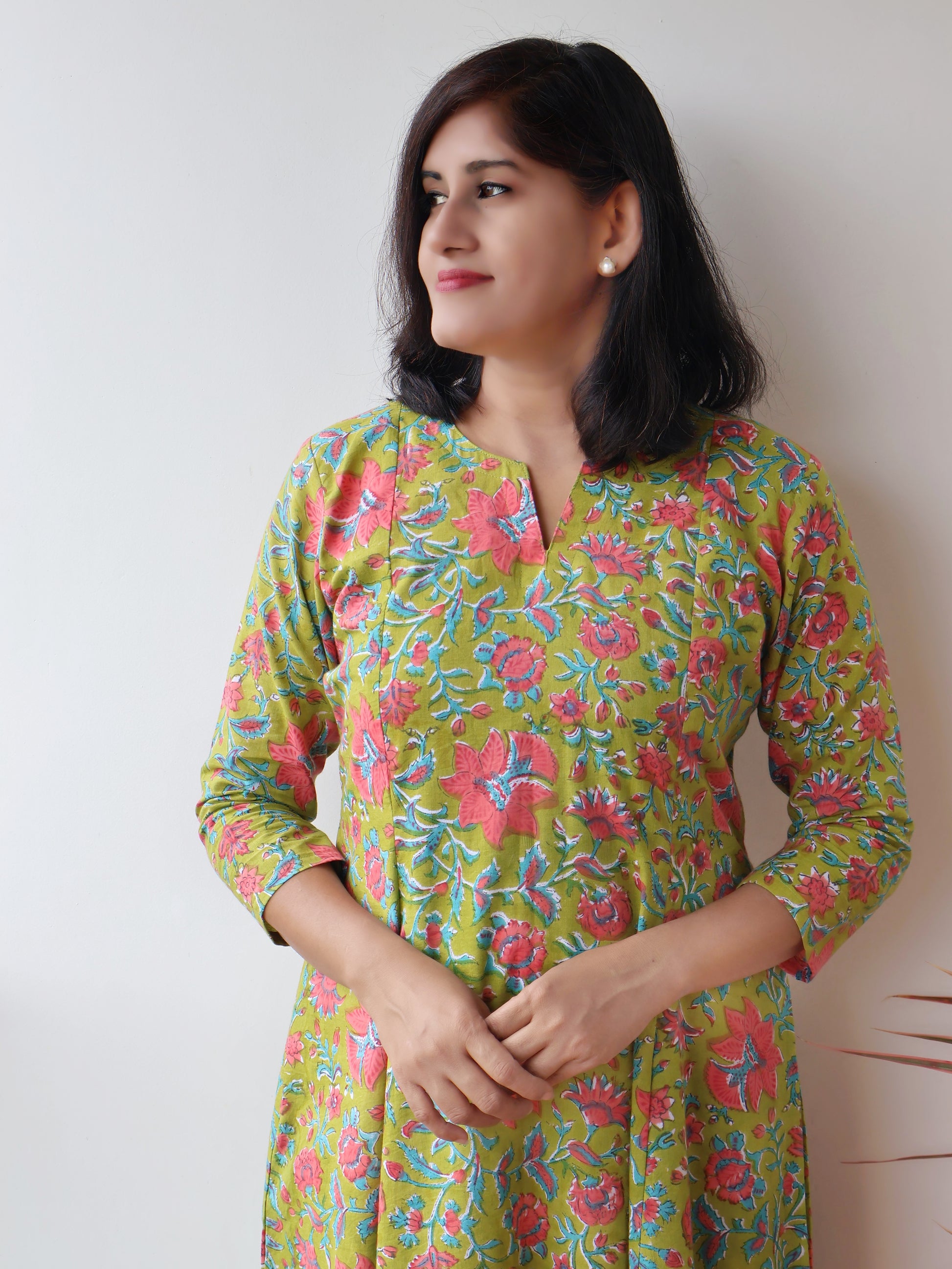 Green Mystique Sanganeri hand block cotton kurta crafted in pure breathable cotton with peach floral print and paneled silhouette