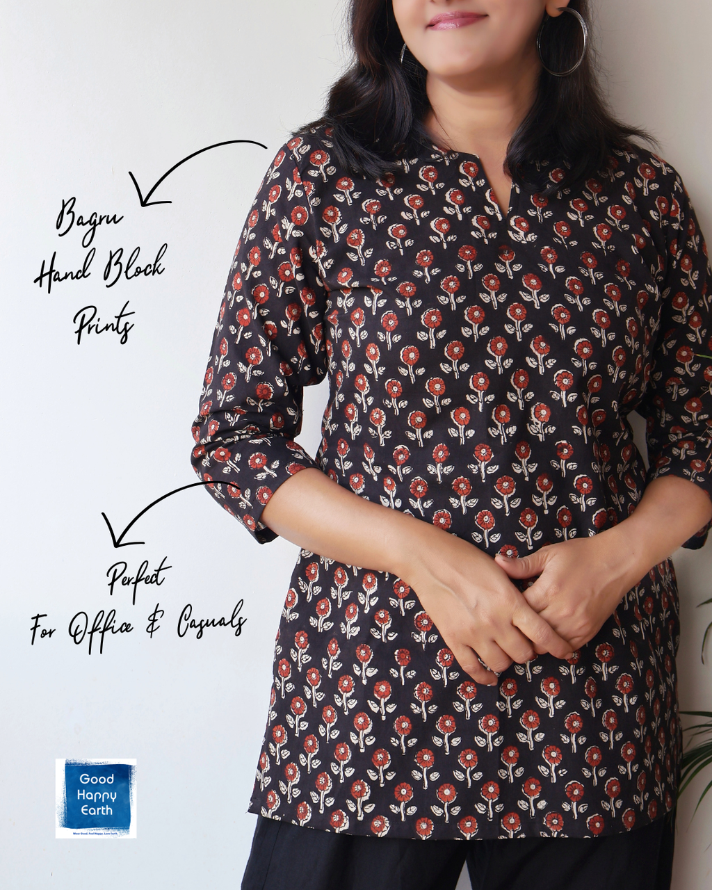 Woman wearing a floral patterned shirt with text on a plain background