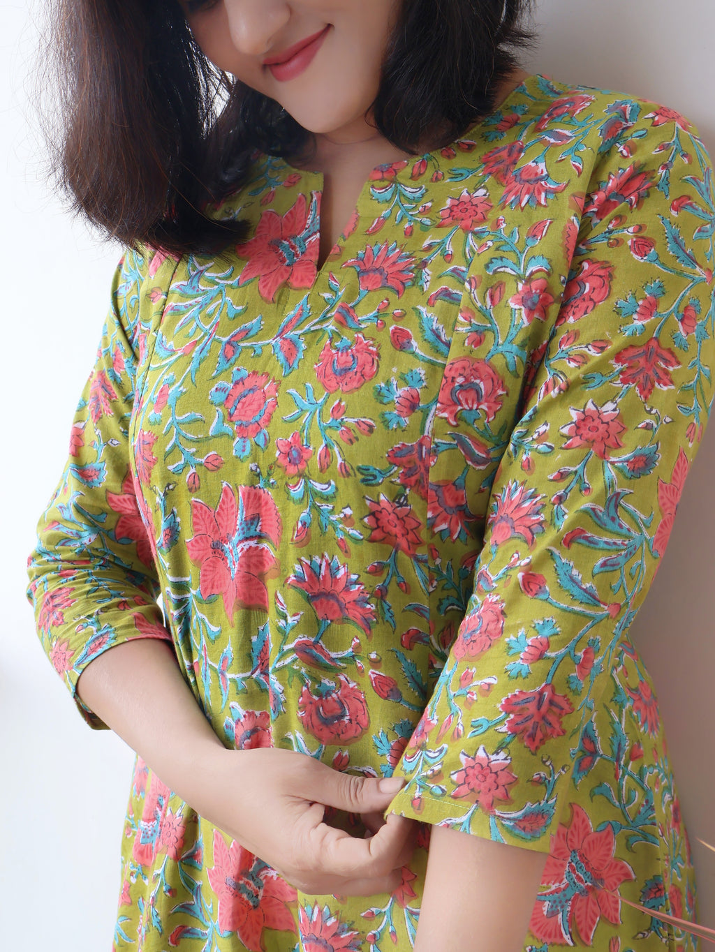 Green Mystique Sanganeri hand block cotton kurta crafted in pure breathable cotton with peach floral print and paneled silhouette