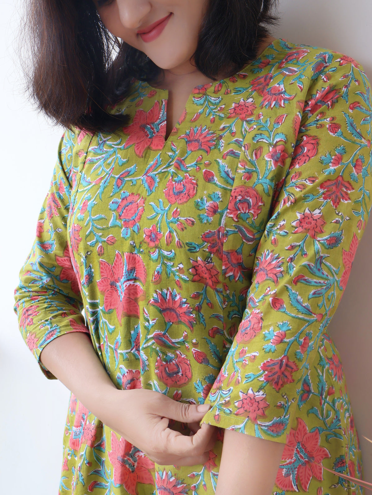 Green Mystique Sanganeri hand block cotton kurta crafted in pure breathable cotton with peach floral print and paneled silhouette