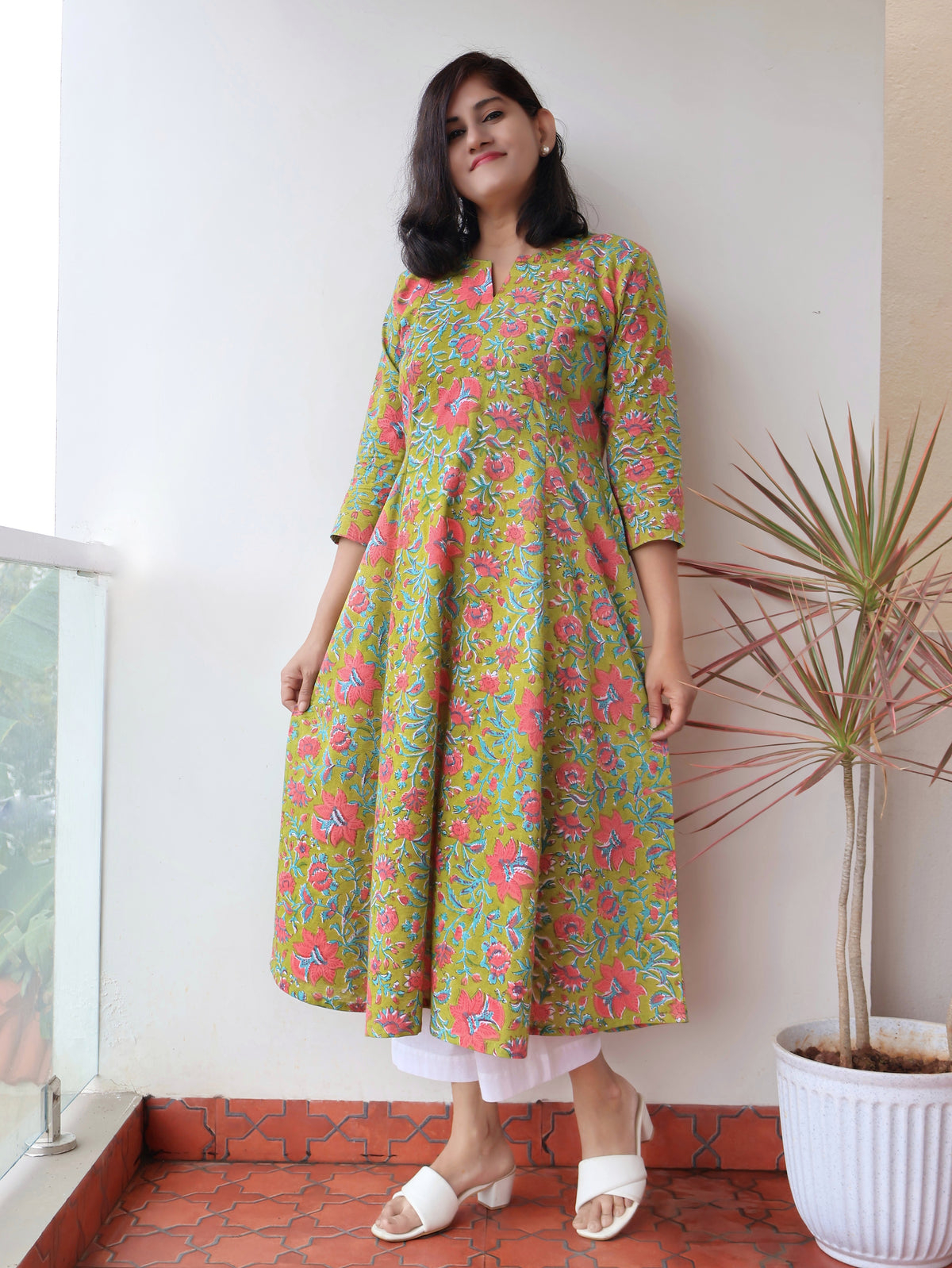 Green Mystique Sanganeri hand block cotton kurta crafted in pure breathable cotton with peach floral print and paneled silhouette
