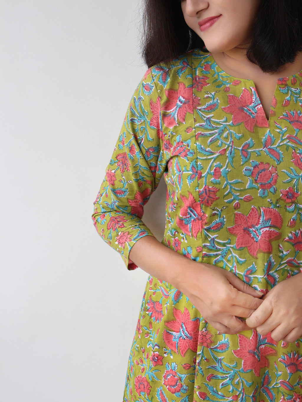 Green Mystique Sanganeri hand block cotton kurta crafted in pure breathable cotton with peach floral print and paneled silhouette