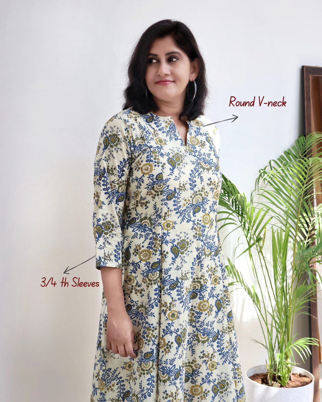 Woman wearing a floral dress with text annotations on a white background