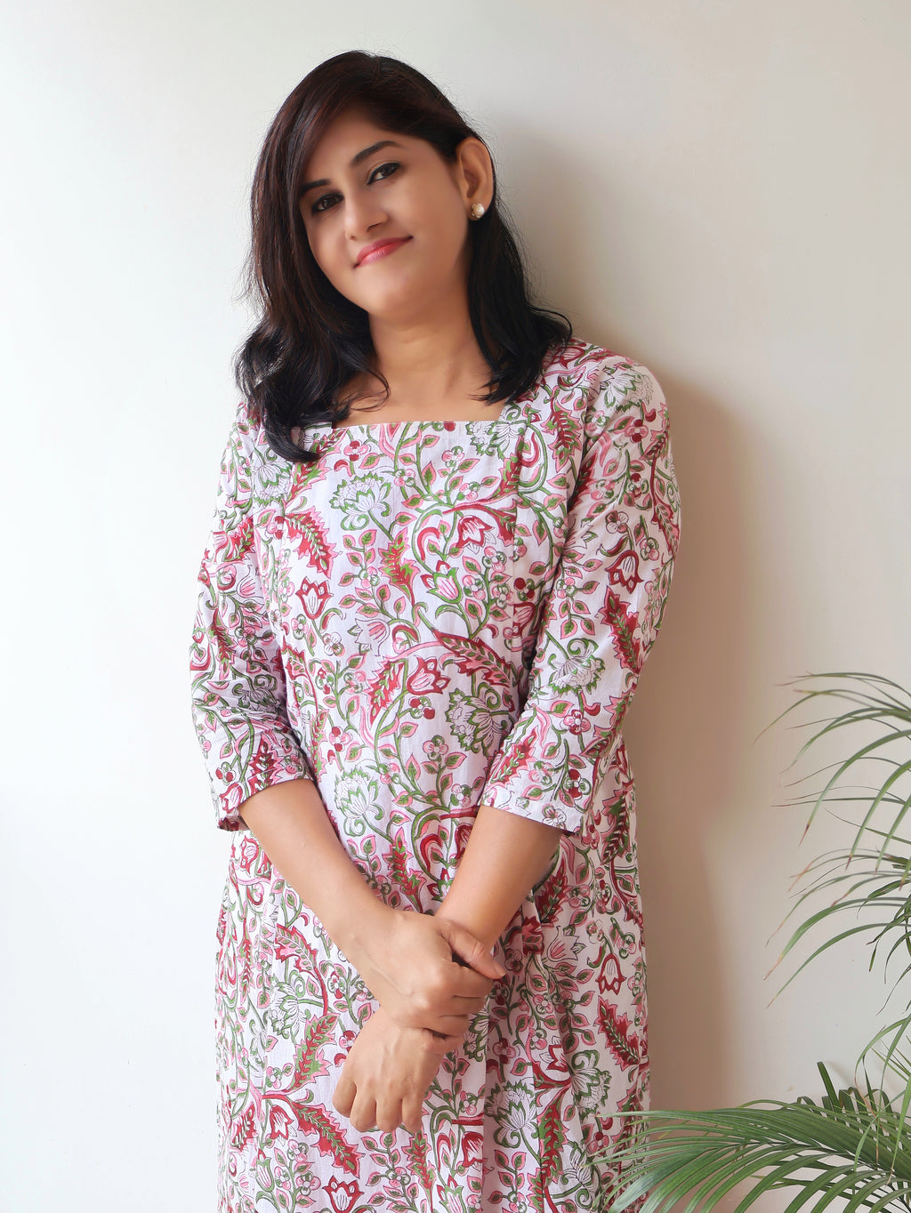 White floral cotton kurta front view showing panelled A-line silhouette and elegant design