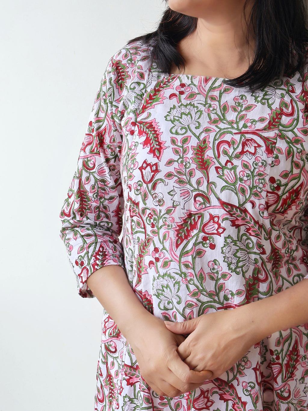 White floral cotton kurta front view showing panelled A-line silhouette and elegant design