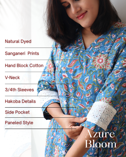 Woman wearing a blue floral printed dress with text detailing fabric and design features.