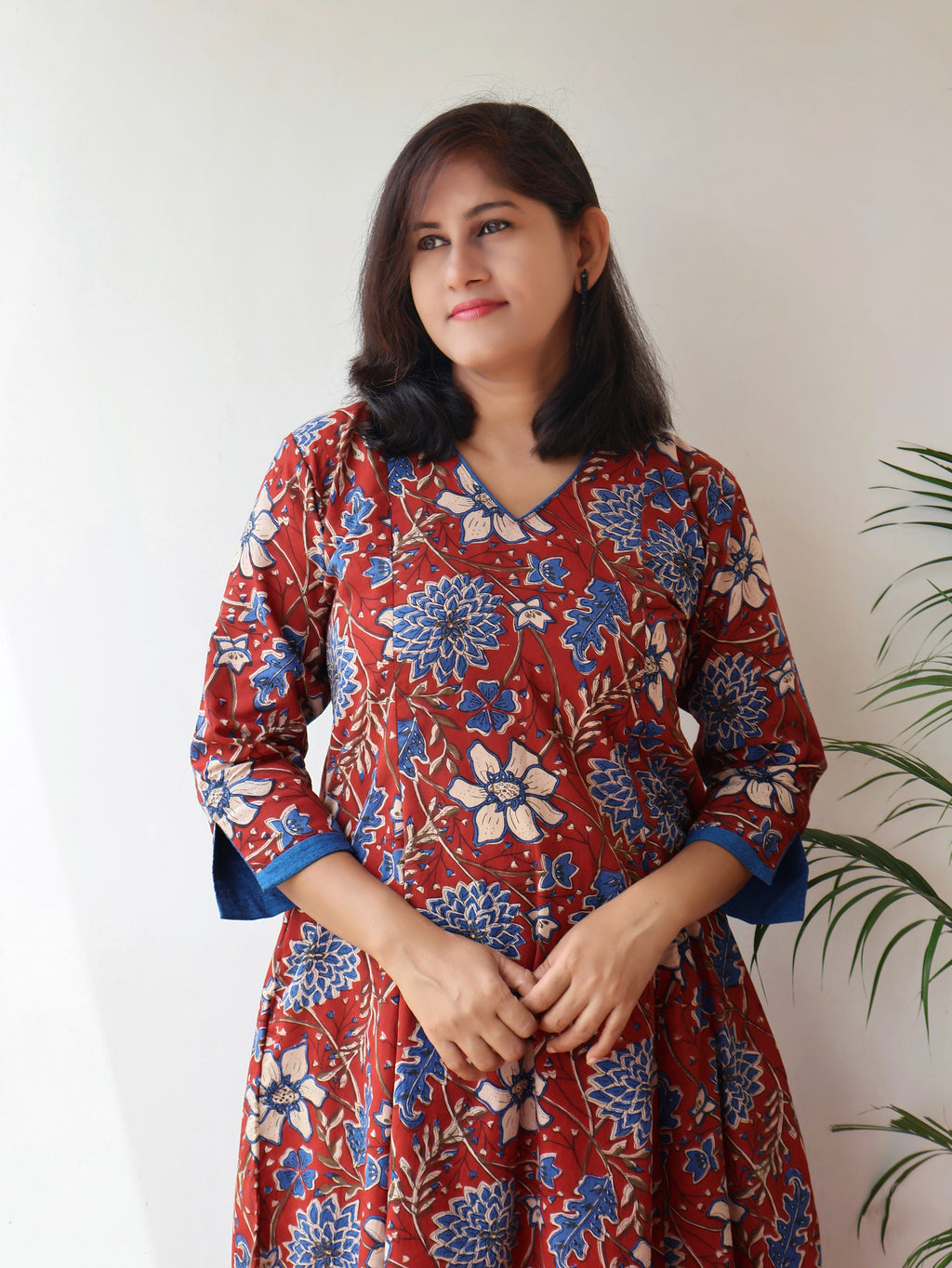 Red blue Bagru hand block cotton kurta with paneled A-line silhouette, curved V-neck, handwoven piping and 3/4 sleeves