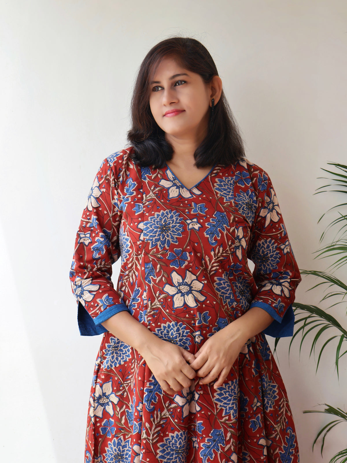 Red blue Bagru hand block cotton kurta with paneled A-line silhouette, curved V-neck, handwoven piping and 3/4 sleeves