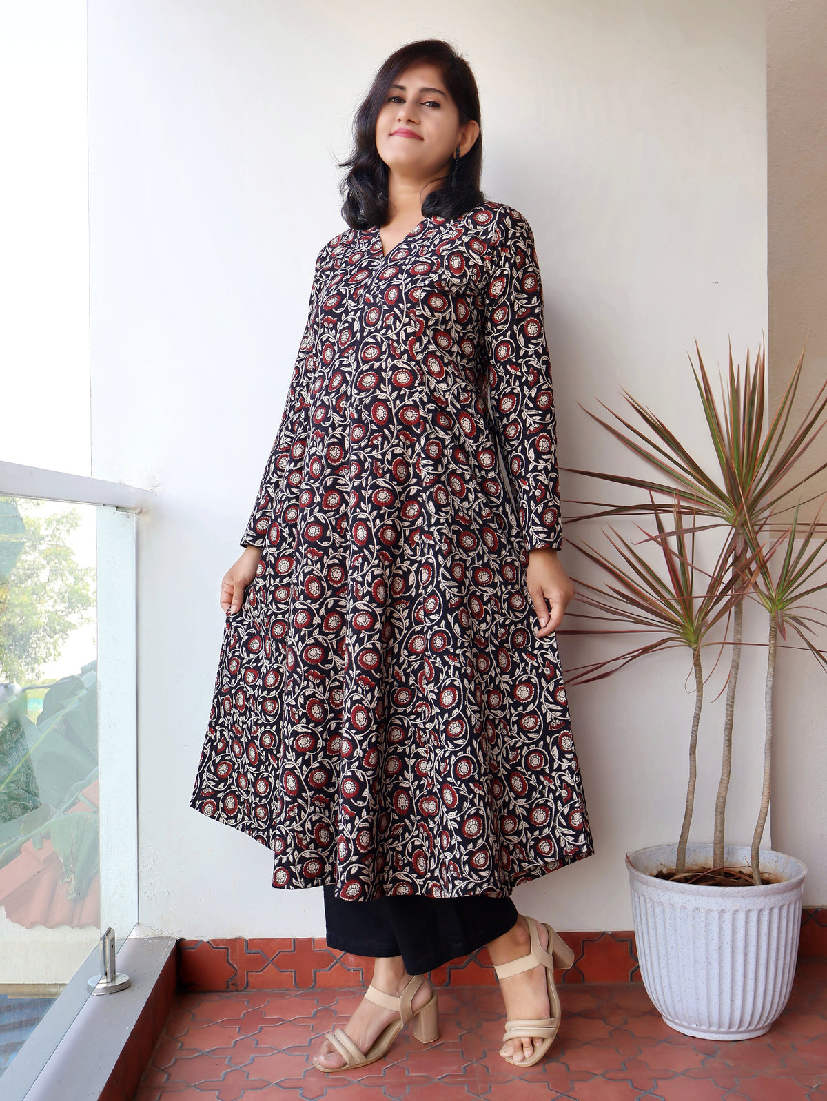 Black Bagru hand block printed cotton kurta for women with V-neck, full sleeves, paneled silhouette and natural dye ethnic print