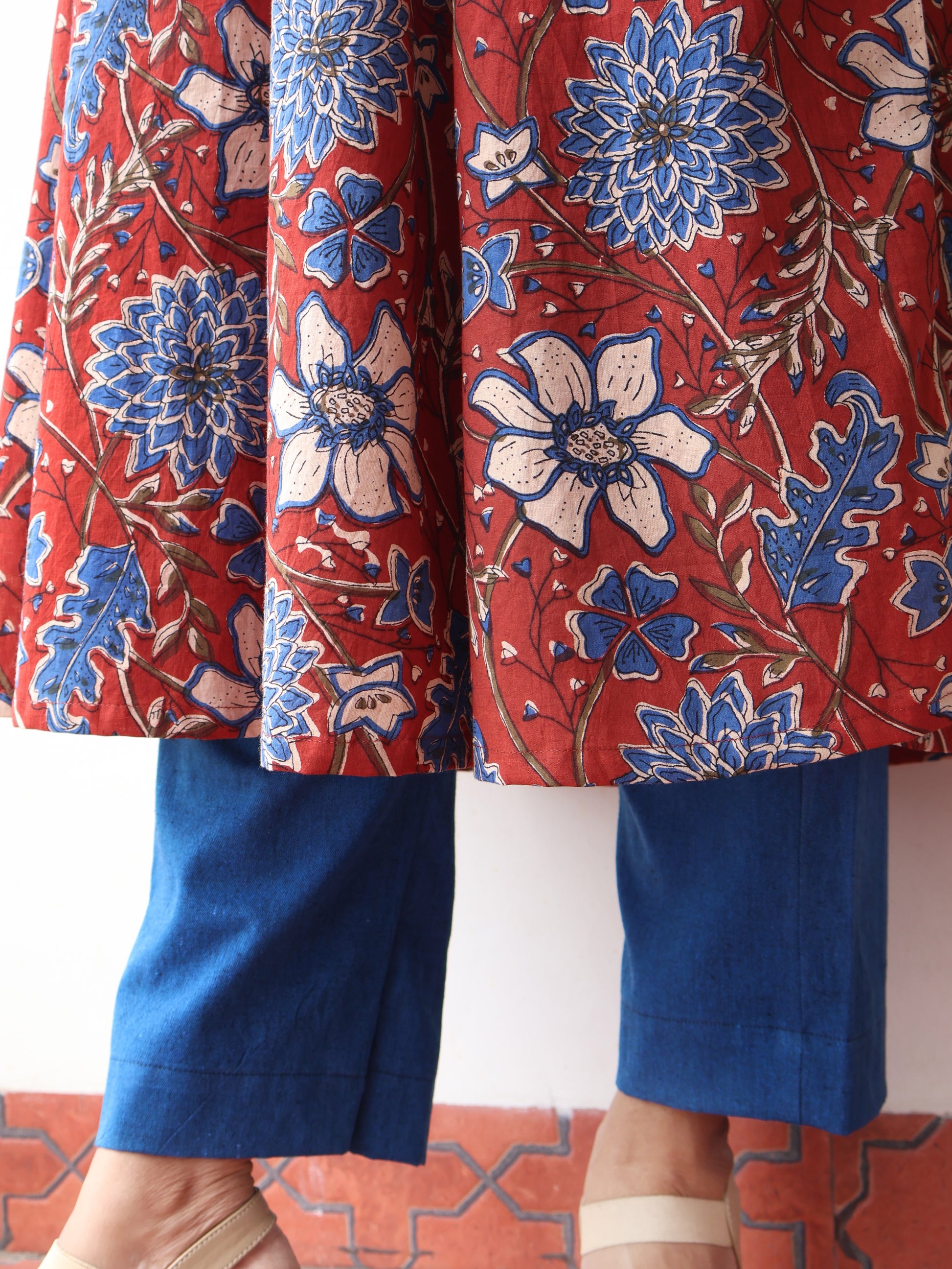 Red blue Bagru hand block cotton kurta with paneled A-line silhouette, curved V-neck, handwoven piping and 3/4 sleeves