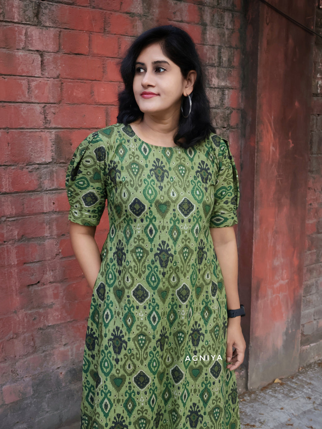 Woman wearing a green breathable soft cotton dress
