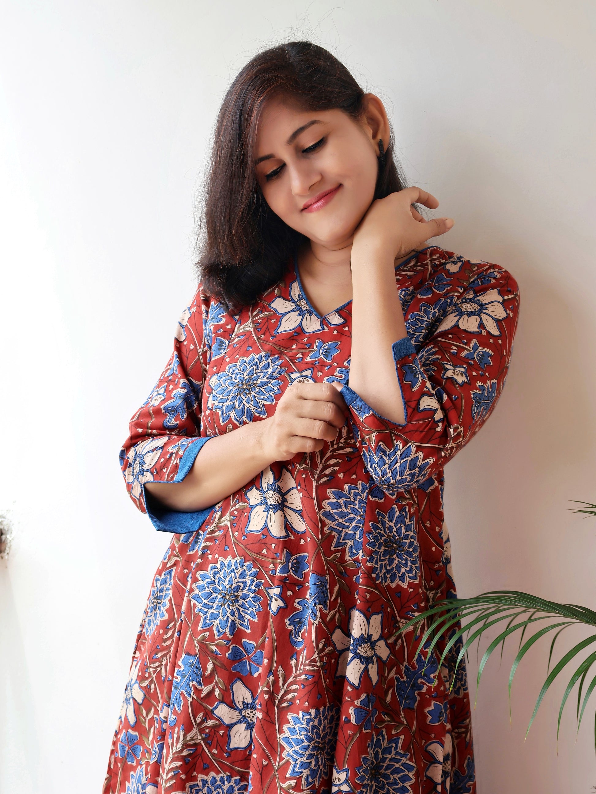 Red blue Bagru hand block cotton kurta with paneled A-line silhouette, curved V-neck, handwoven piping and 3/4 sleeves