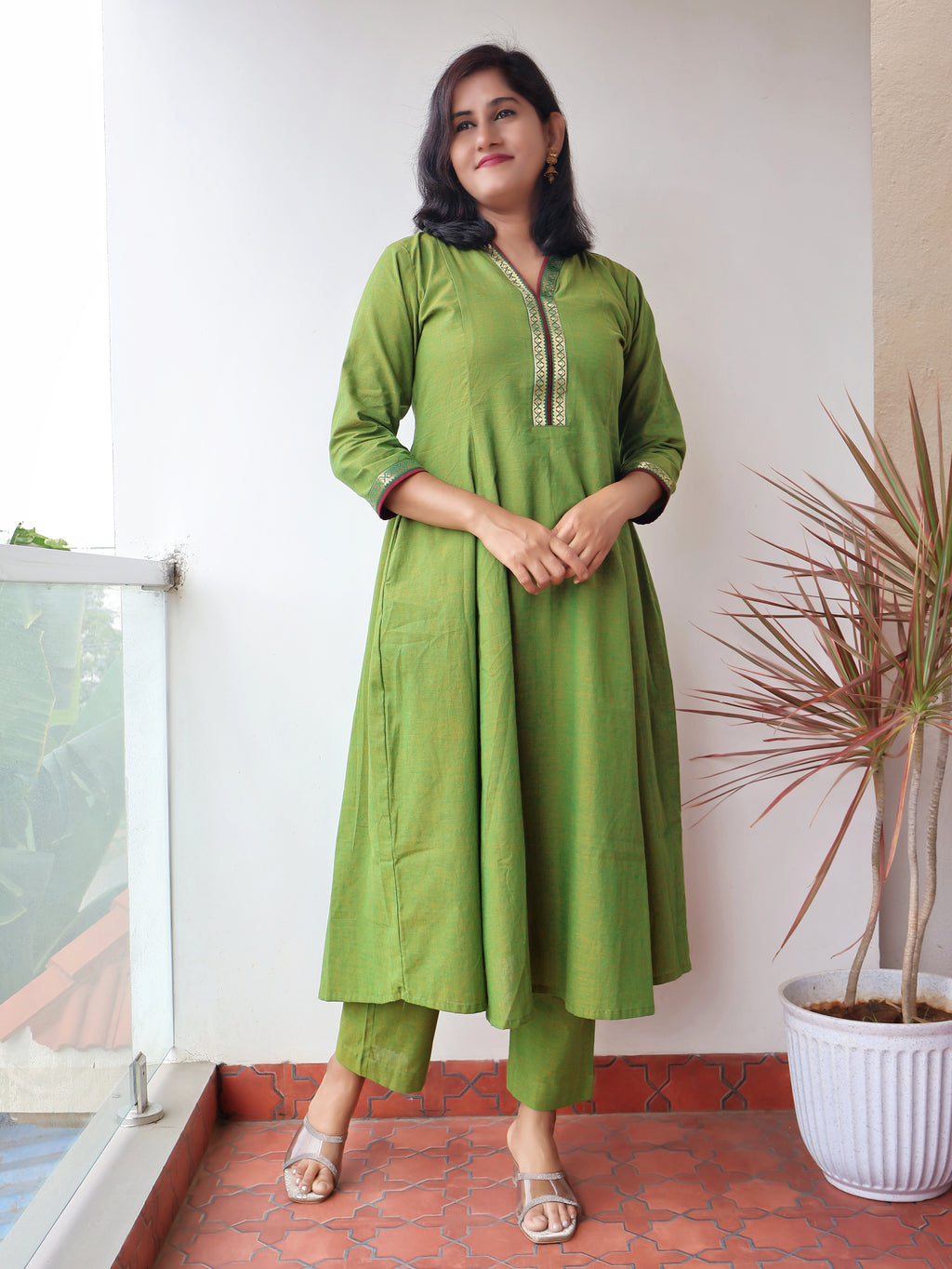 Tulsi Green Handloom Cotton Kurta with collar V-neck contrast trims and zari detailing - full view of model