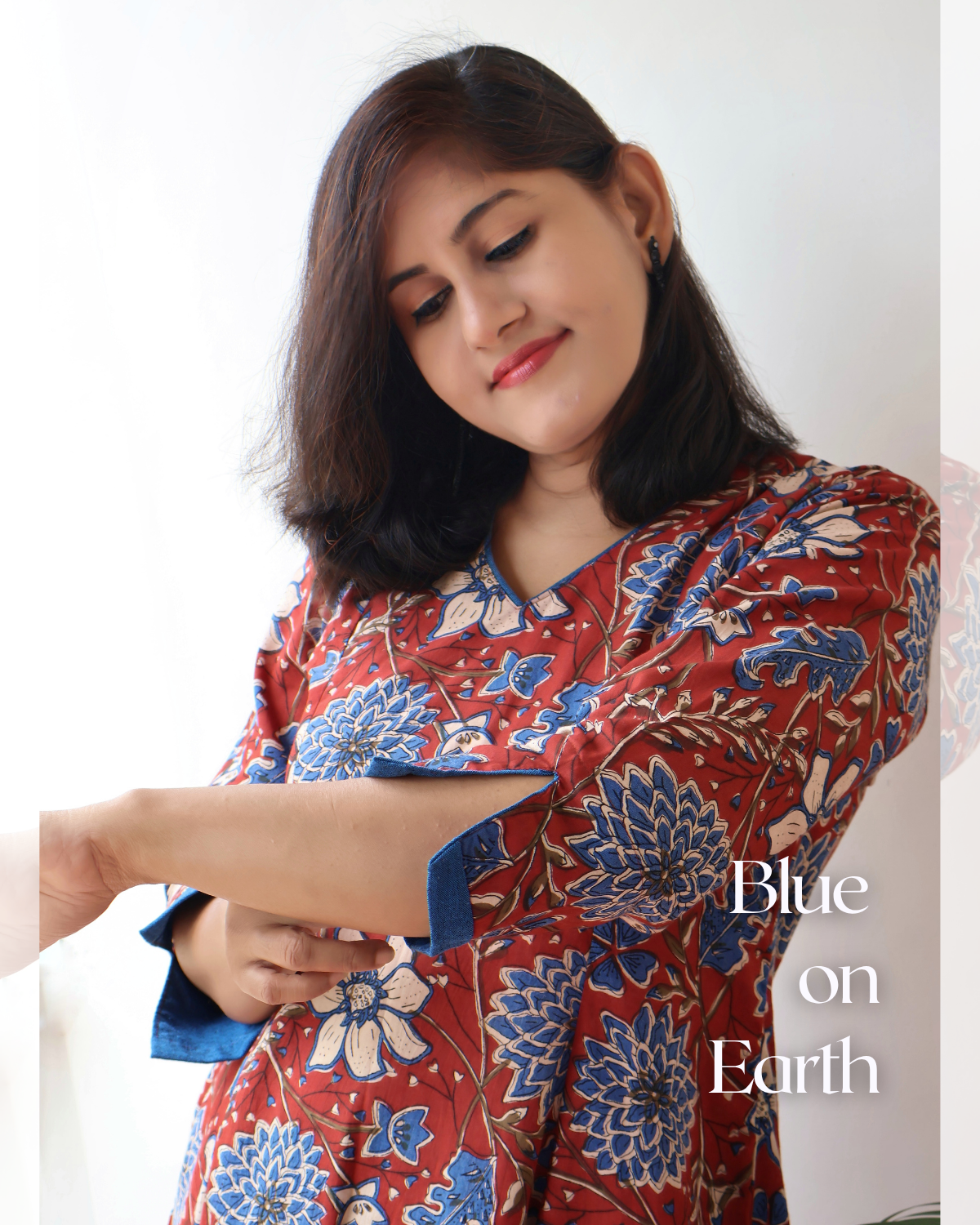 Red blue Bagru hand block cotton kurta with paneled A-line silhouette, curved V-neck, handwoven piping and 3/4 sleeves