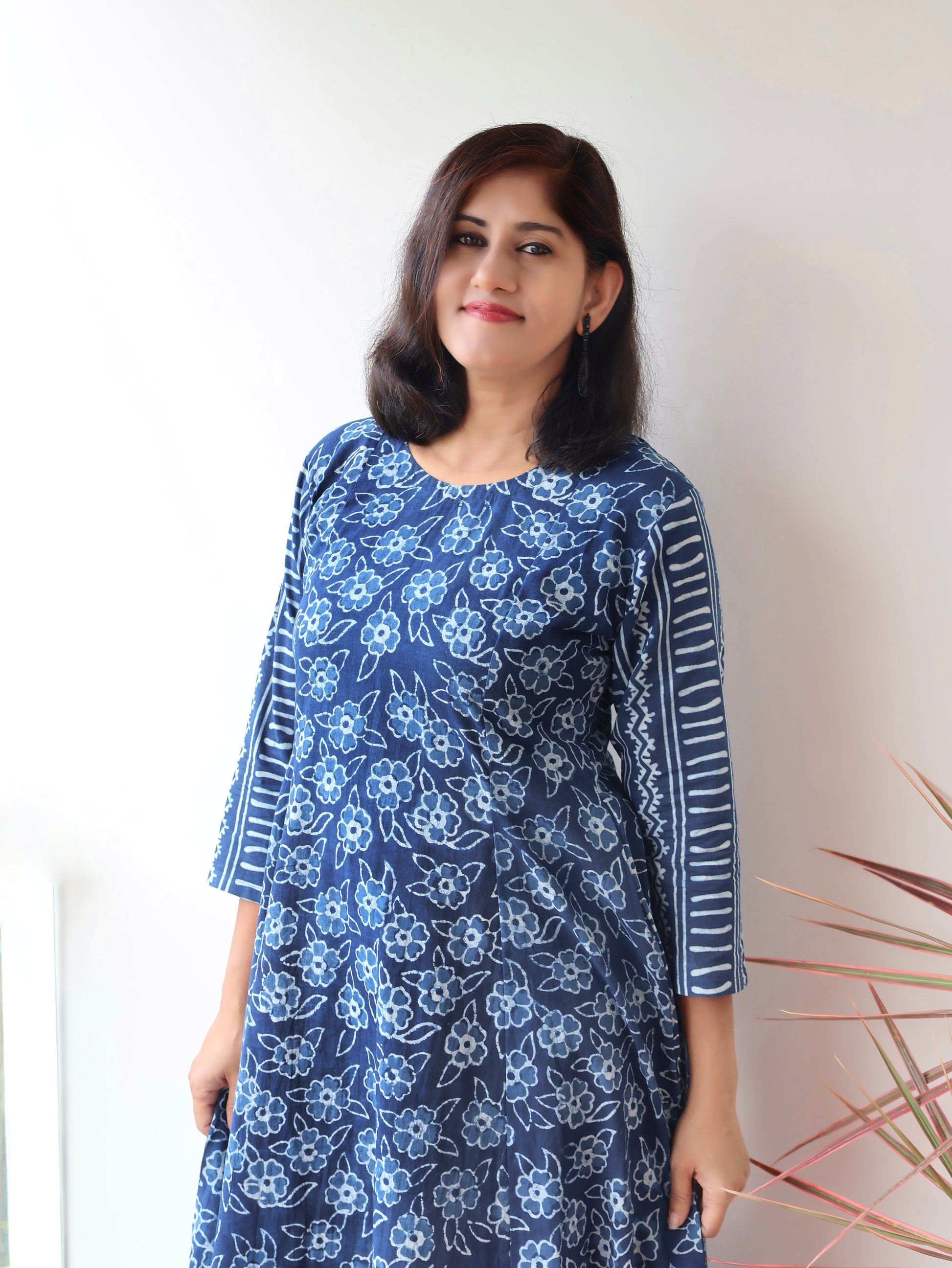 Women wearing Indigo Natural Dyed Floral Dabu Hand Block Printed Cotton Kurta with paneled style and striped sleeves
