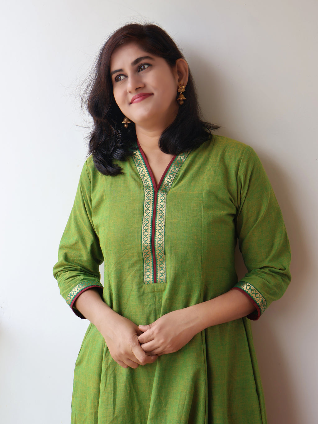 Tulsi Green Handloom Cotton Kurta with collar V-neck contrast trims and zari detailing - closup view