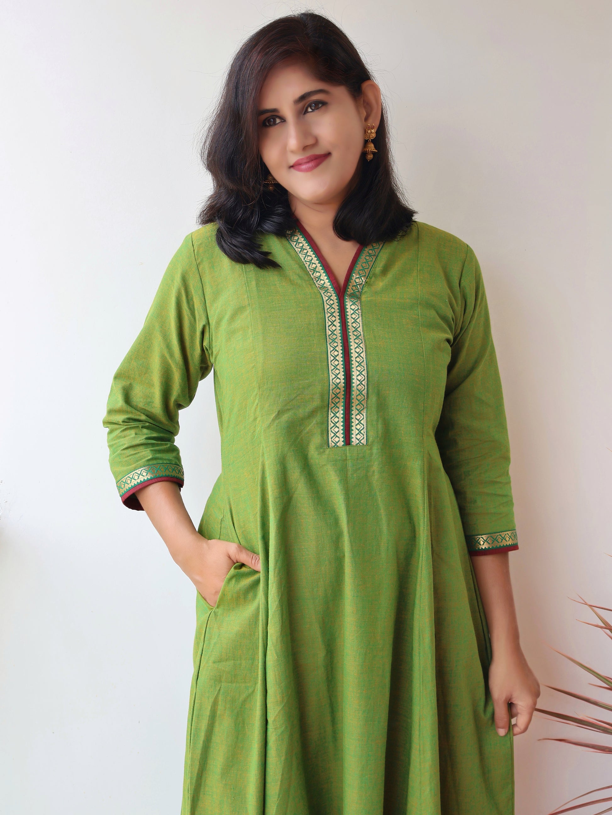 Tulsi Green Handloom Cotton Kurta with collar V-neck contrast trims and zari detailing, pocket 