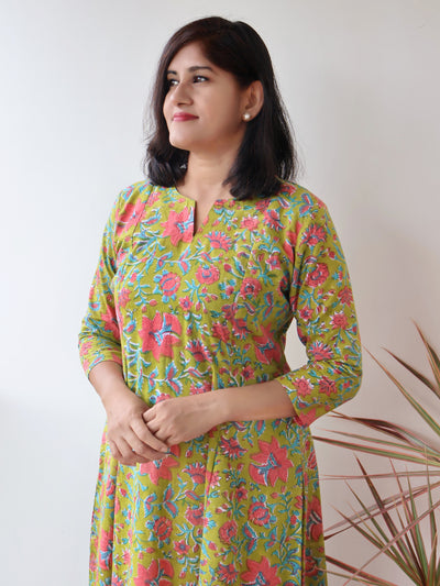 Close-up of peach floral Sanganeri hand block prints on Green Mystique Cotton Kurta,