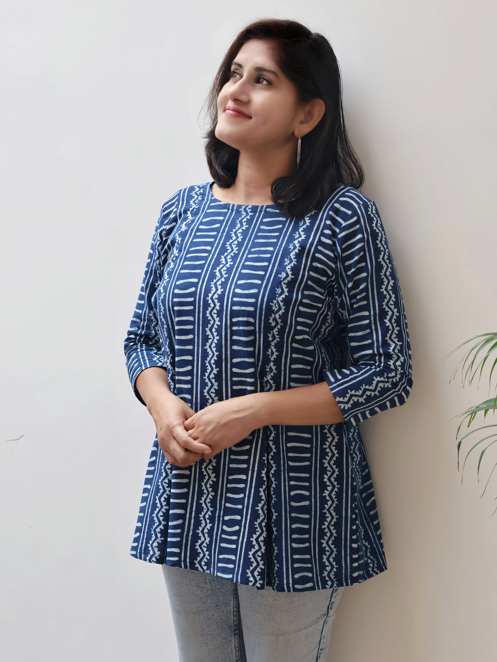 Detailed view of round neckline and panel-style design on Indigo summer short top, lightweight and comfy