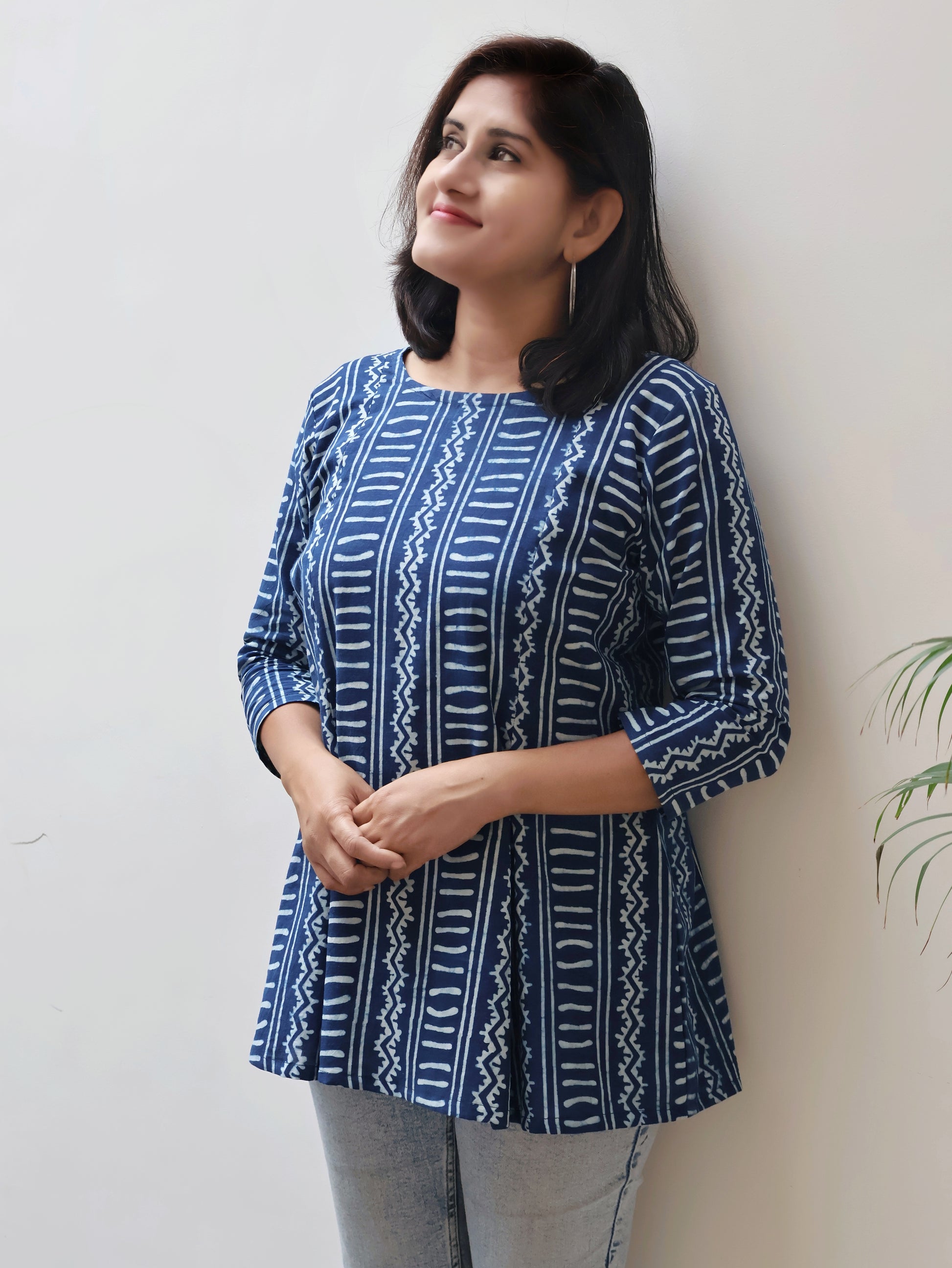 Detailed view of round neckline and panel-style design on Indigo summer short top, lightweight and comfy