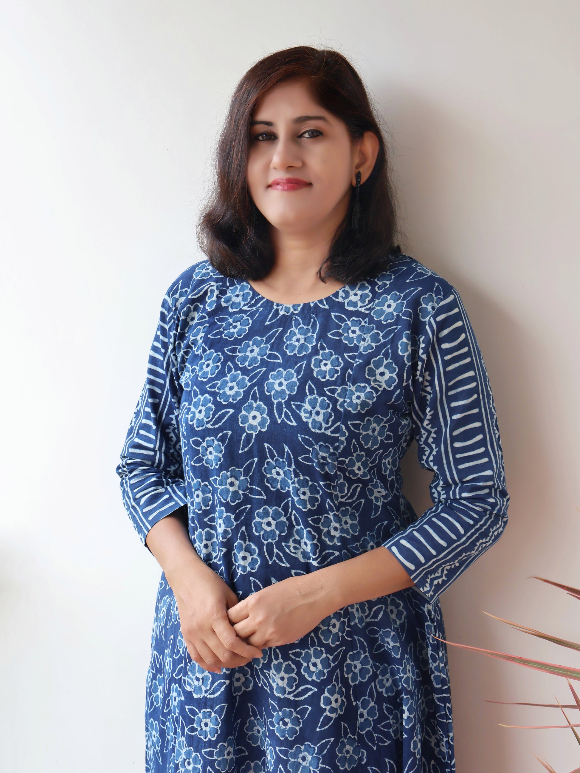 Women wearing Indigo Natural Dyed Floral Dabu Hand Block Printed Cotton Kurta with paneled style and striped sleeves