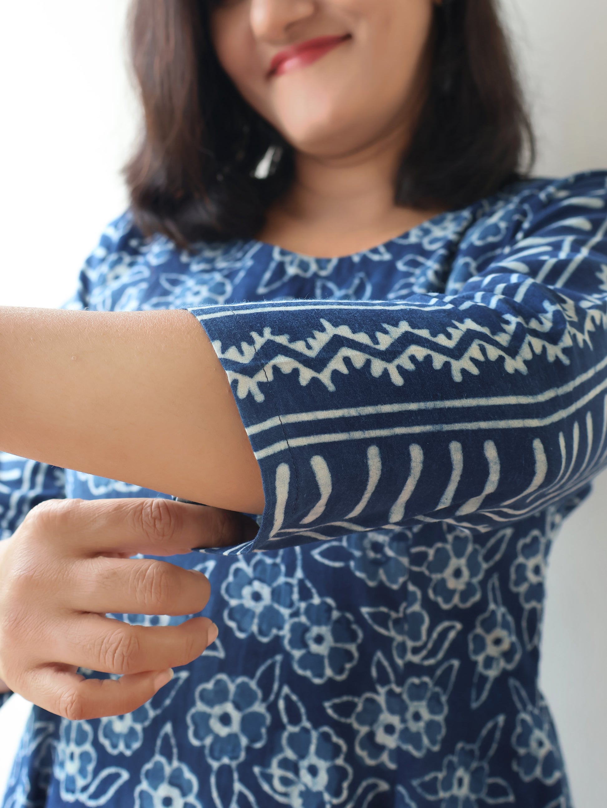 Women wearing Indigo Natural Dyed Floral Dabu Hand Block Printed Cotton Kurta with paneled style and striped sleeves