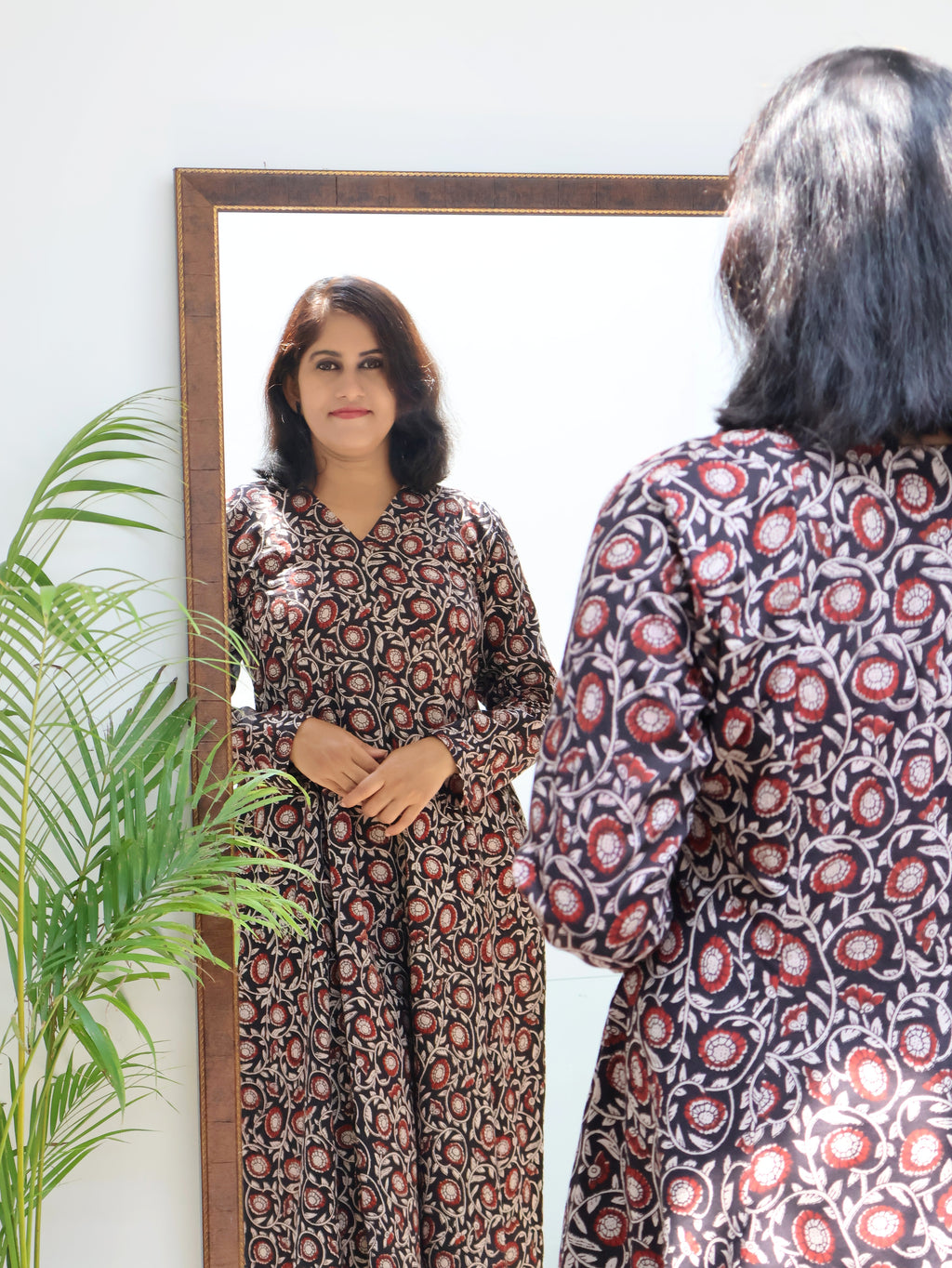 Black Bagru hand block printed cotton kurta for women with V-neck, full sleeves, paneled silhouette and natural dye ethnic print