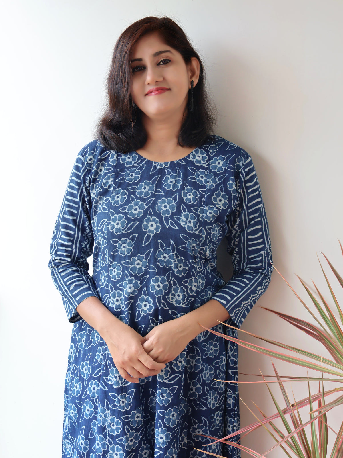 Women wearing Indigo Natural Dyed Floral Dabu Hand Block Printed Cotton Kurta with paneled style and striped sleeves