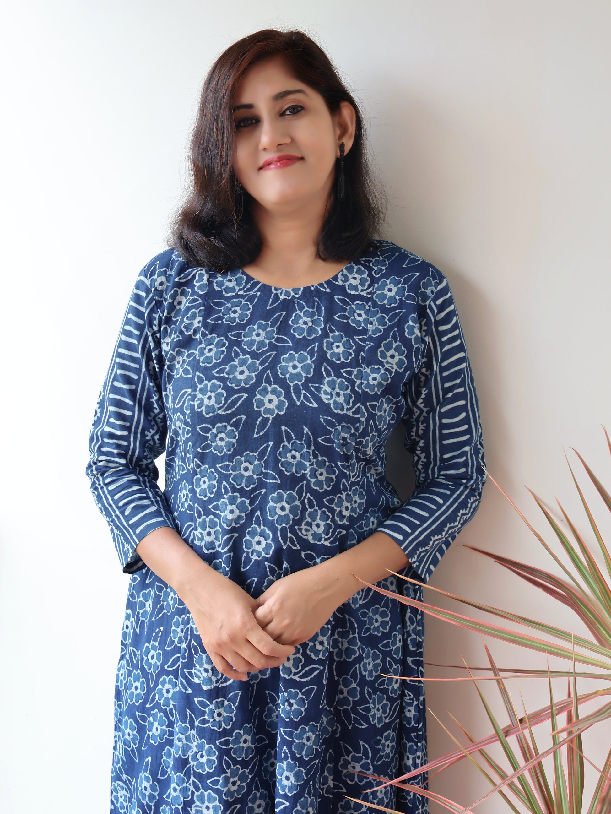 Women wearing Indigo Natural Dyed Floral Dabu Hand Block Printed Cotton Kurta with paneled style and striped sleeves