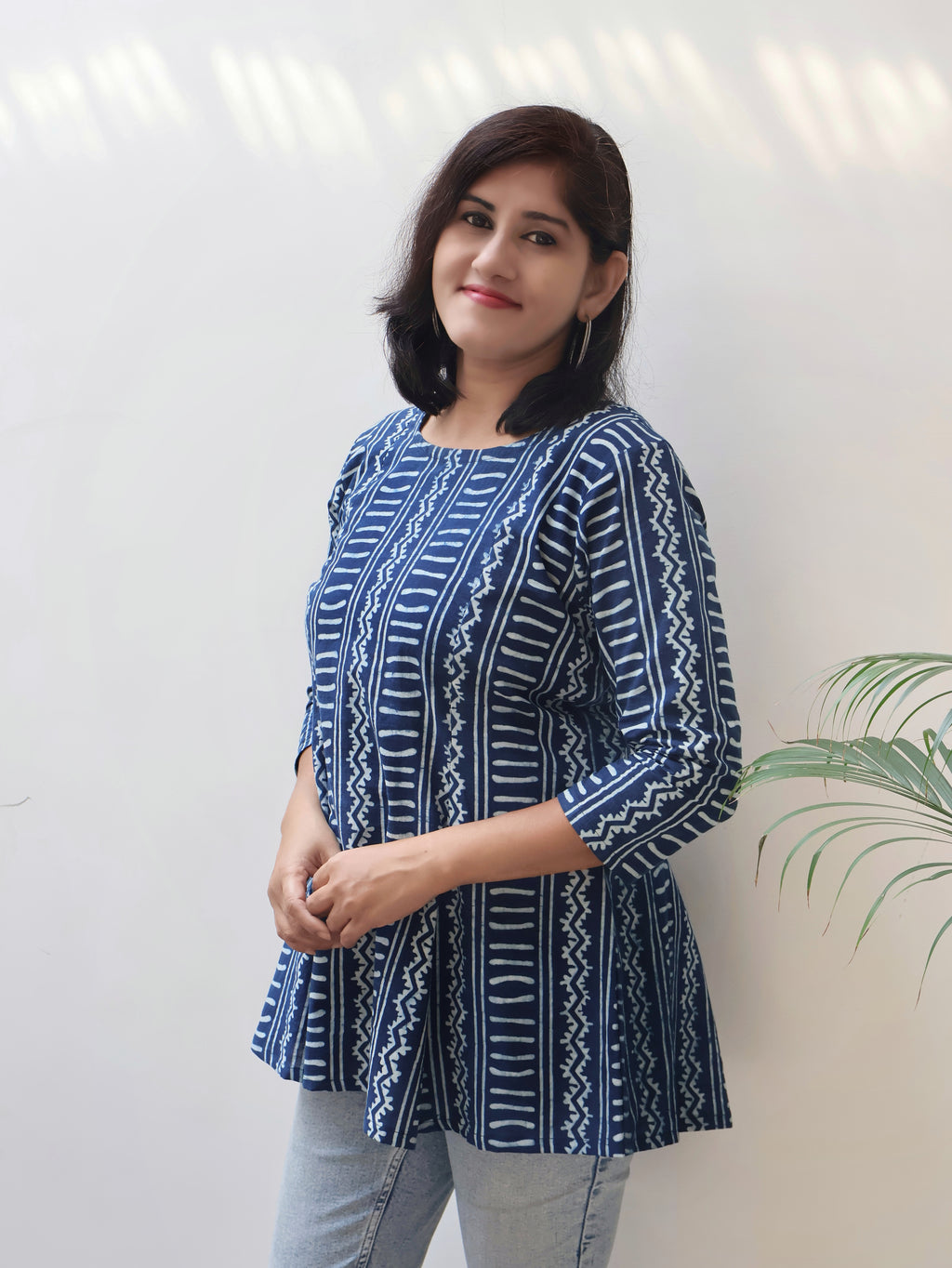 Detailed view of round neckline and panel-style design on Indigo summer short top, lightweight and comfy