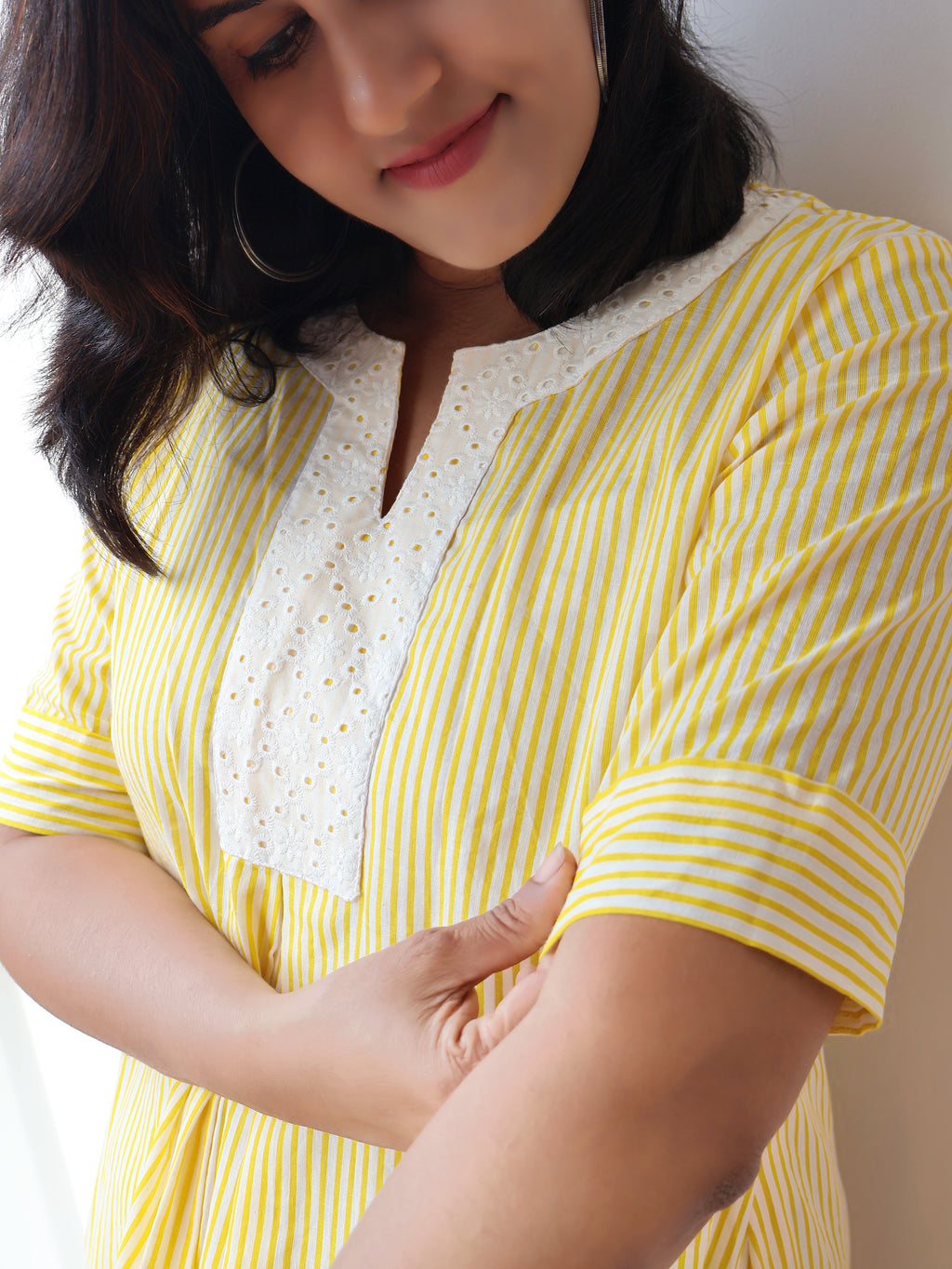 Yellow printed pure cotton A-line kurta featuring white Hakoba patchwork yoke