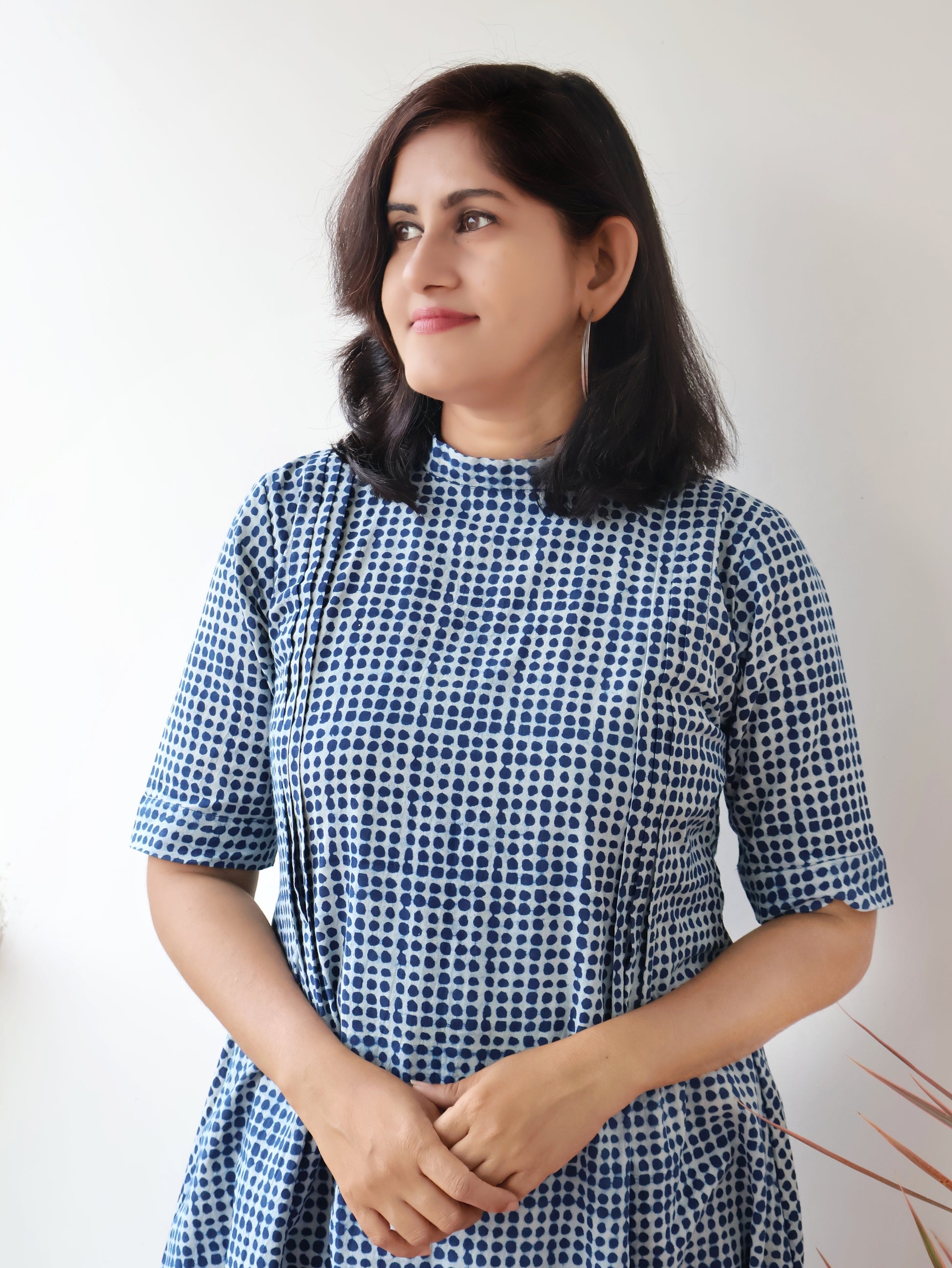 Detailed shot of pintuck work and high collar design on indigo cotton kurta