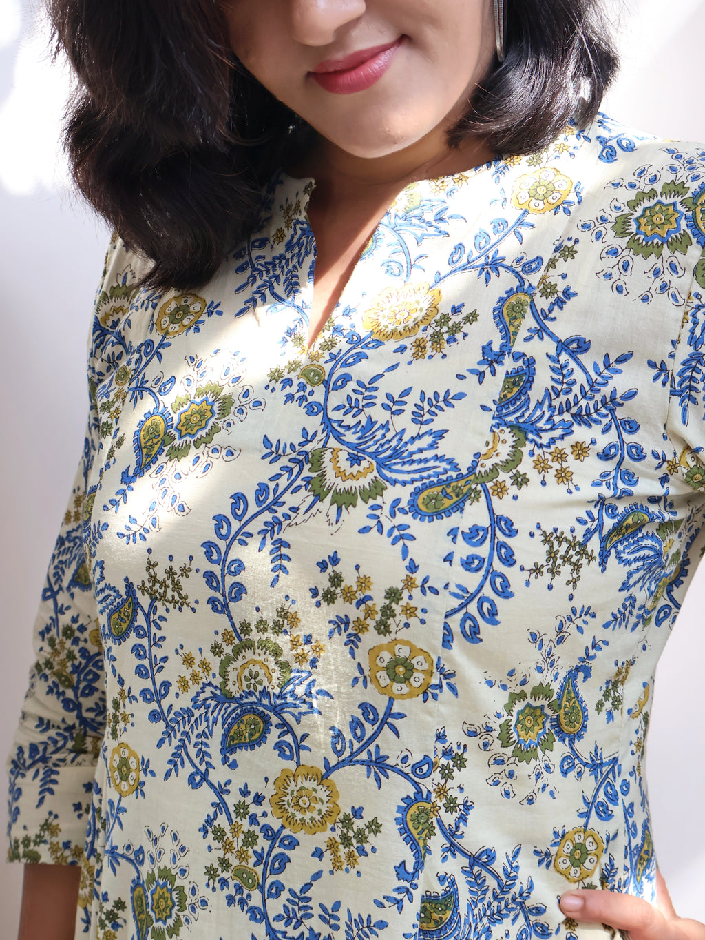 Woman wearing ivory floral Bagru hand block panel kurta in breathable pure cotton
