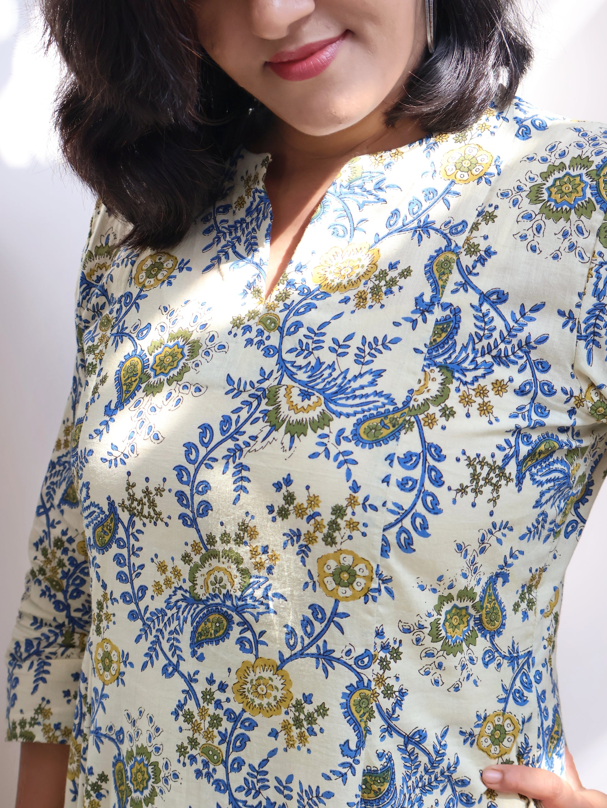 Woman wearing ivory floral Bagru hand block panel kurta in breathable pure cotton