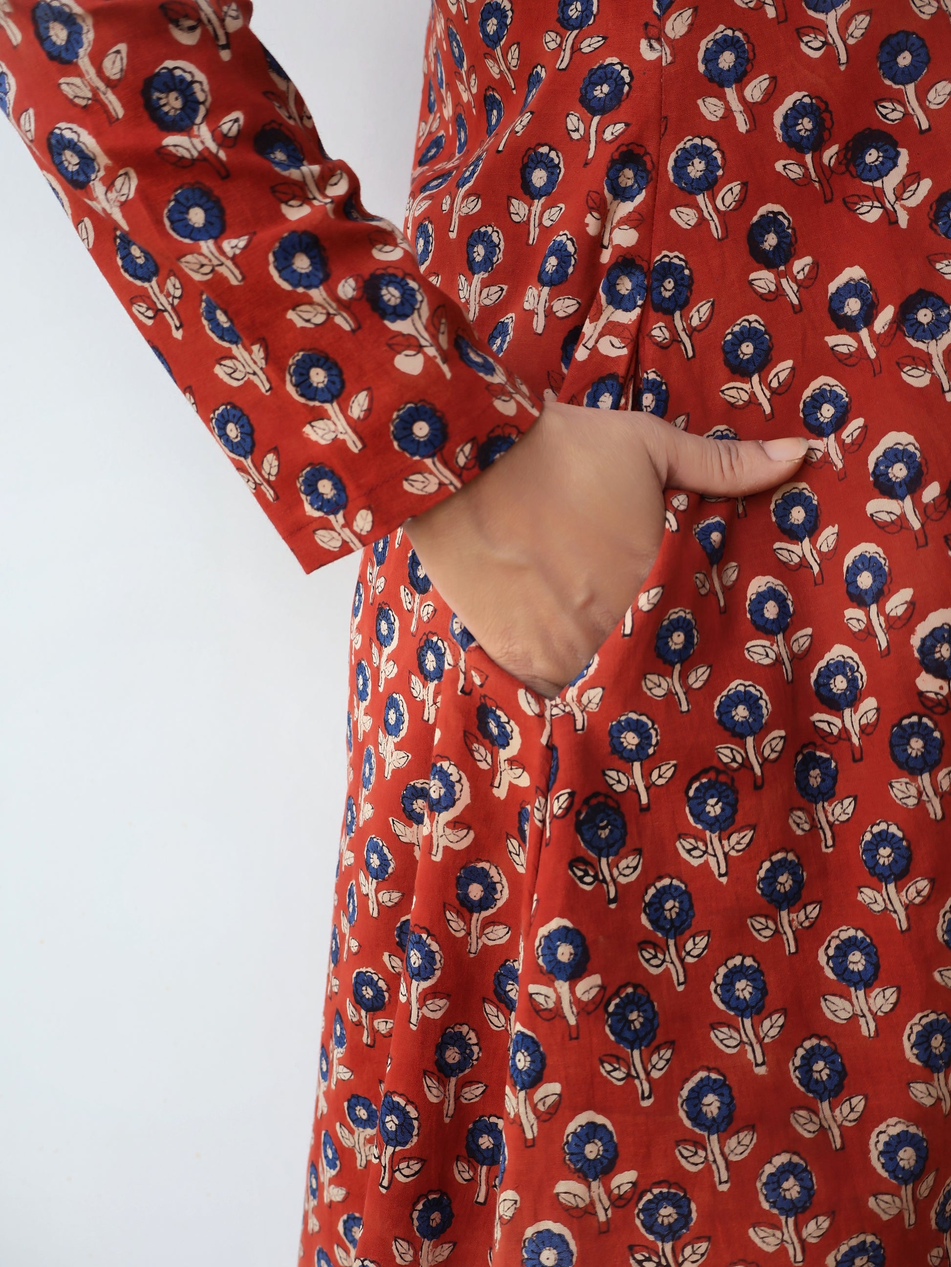 Red floral patterned kurta with a white background