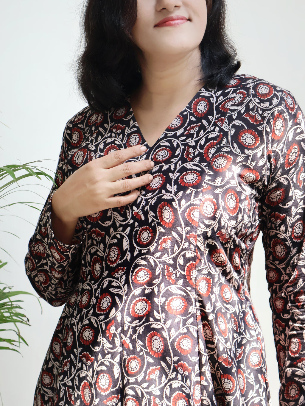 Black Bagru hand block long cotton kurta with V-neck, full sleeves and paneled silhouette