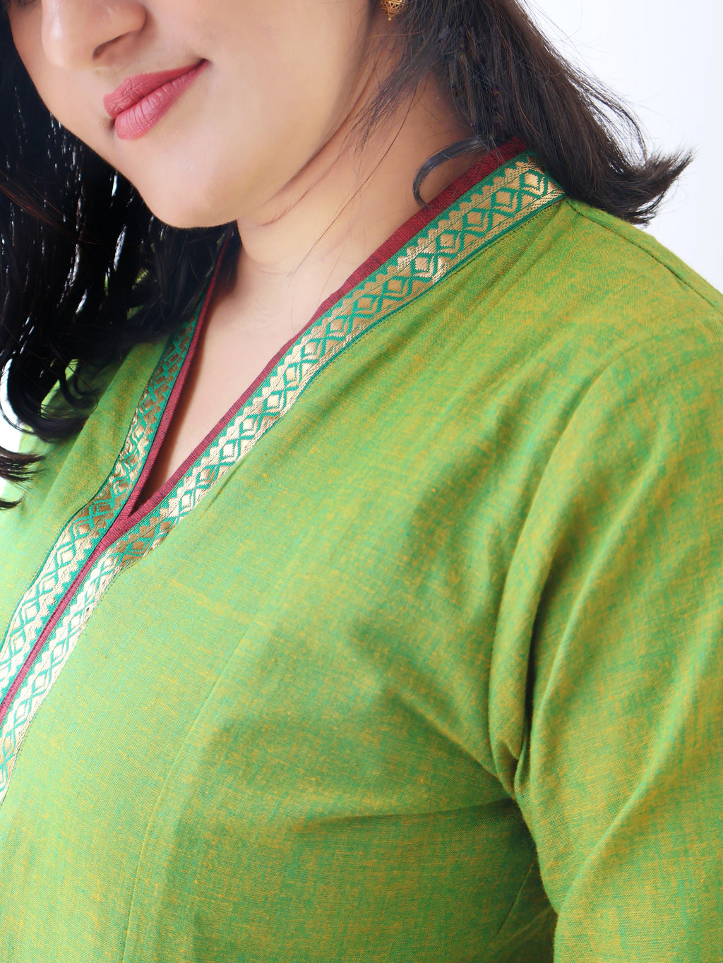 Tulsi Green Handloom Cotton Kurta with collar V-neck contrast trims and zari detailing - closeup view