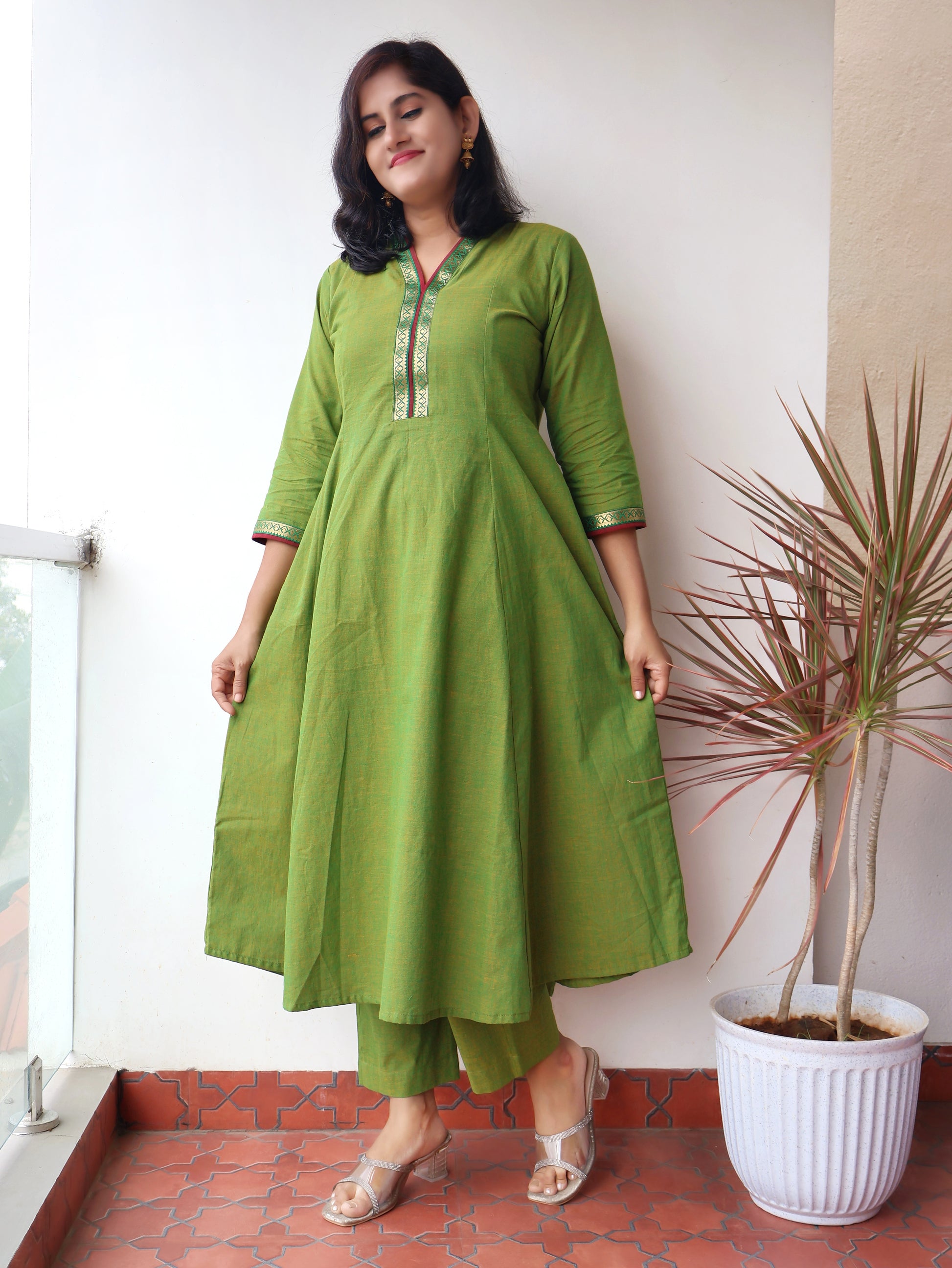 Tulsi Green Handloom Cotton Kurta with collar V-neck contrast trims and zari detailing,sinature panel style