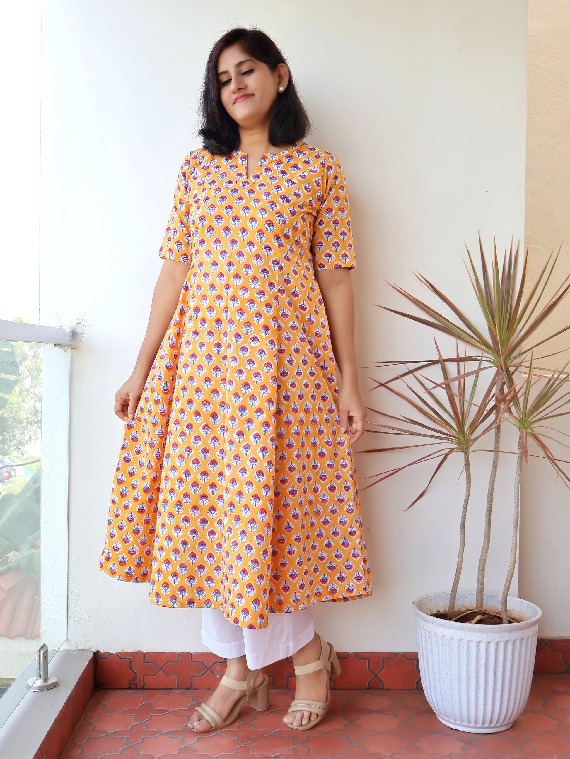 Pure cotton yellow kurta with traditional Sanganeri red butti print and elbow sleeves